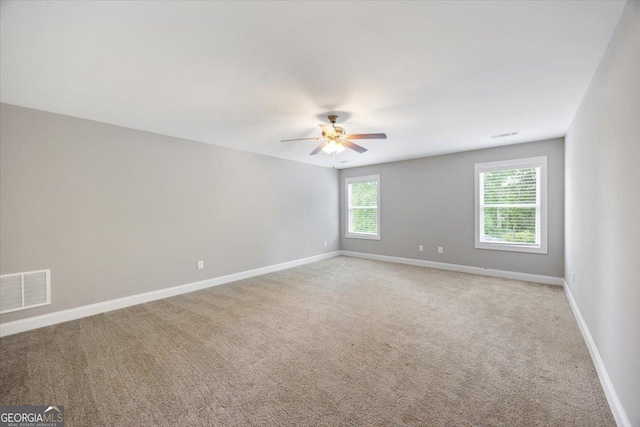 14 Carters Way, Forsyth, GA 31029 - empty room featuring ceiling fan, light colored carpet, and baseboards