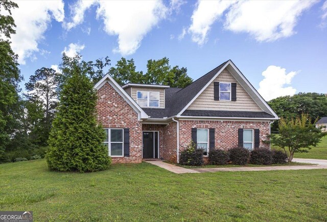 14 Carters Way, Forsyth, GA 31029 - view of front facade with a front lawn, brick siding, and roof with shingles