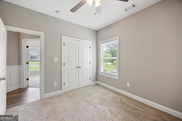 14 Carters Way, Forsyth, GA 31029 - unfurnished bedroom featuring carpet flooring, a closet, a ceiling fan, and baseboards