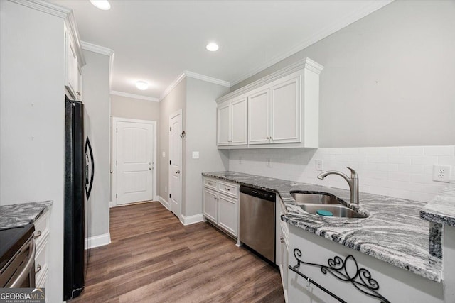 14 Carters Way, Forsyth, GA 31029 - kitchen with stainless steel appliances, a sink, dark wood-style floors, tasteful backsplash, and light stone counters
