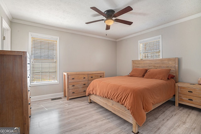 1875 Ebenezer Rd SW, Conyers, GA 30094 - bedroom with light wood-style floors, ornamental molding, baseboards, a textured ceiling, and a ceiling fan