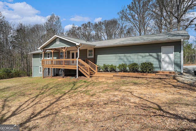 1875 Ebenezer Rd SW, Conyers, GA 30094 - rear view of house with a deck and a yard