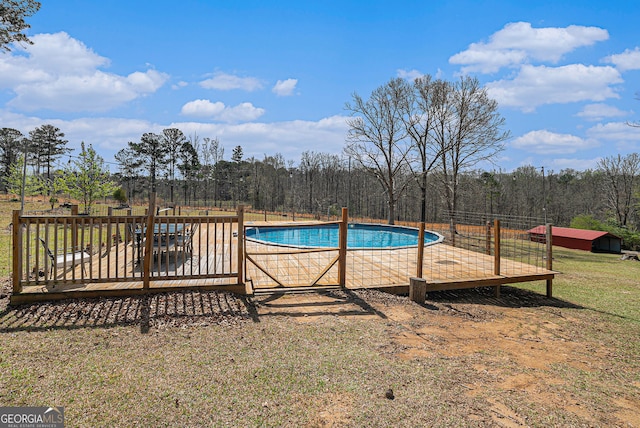 1875 Ebenezer Rd SW, Conyers, GA 30094 - view of swimming pool with a wooden deck and a yard
