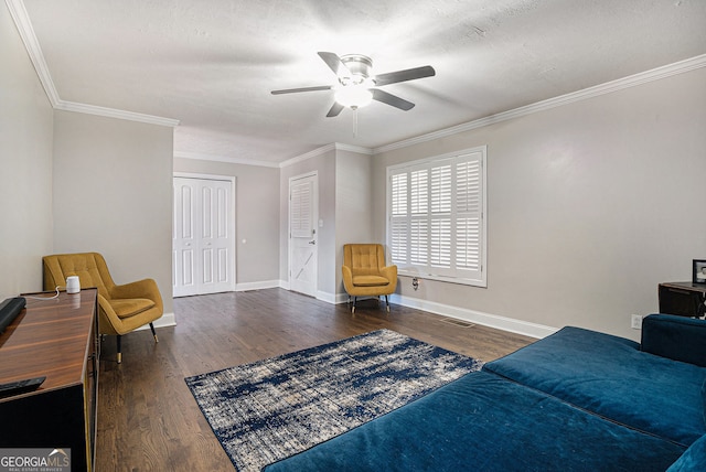 1875 Ebenezer Rd SW, Conyers, GA 30094 - living area featuring wood finished floors, a ceiling fan, baseboards, and crown molding