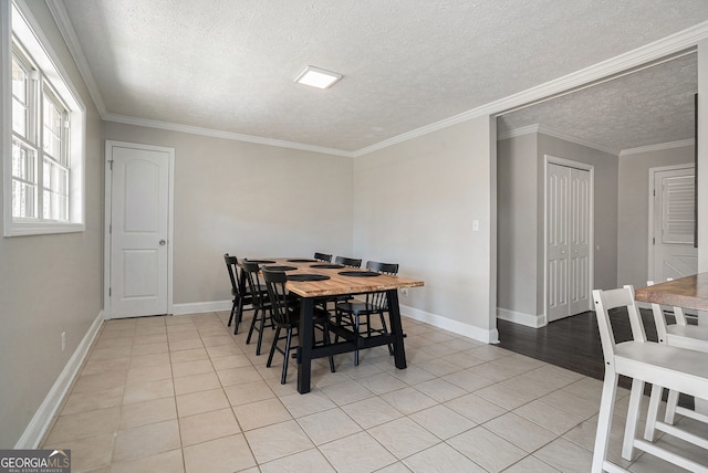 1875 Ebenezer Rd SW, Conyers, GA 30094 - dining space with a textured ceiling, light tile patterned floors, baseboards, and ornamental molding