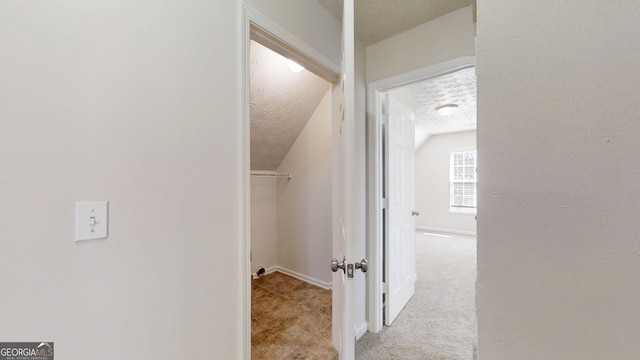 921 Dunagan Way, Lawrenceville, GA 30045 - hallway with vaulted ceiling and carpet floors