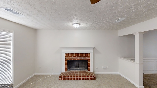 921 Dunagan Way, Lawrenceville, GA 30045 - unfurnished living room with a fireplace, carpet floors, and a textured ceiling