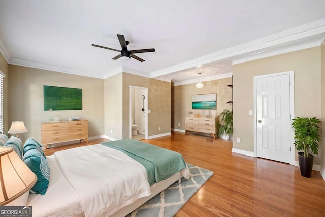 bedroom with ceiling fan, wood finished floors, baseboards, and ornamental molding