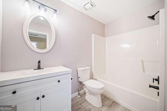 full bath with wood finish floors, visible vents, toilet,  shower combination, and vanity