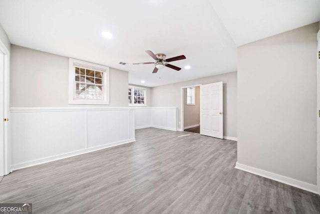 unfurnished living room featuring wood finished floors, baseboards, visible vents, recessed lighting, and ceiling fan