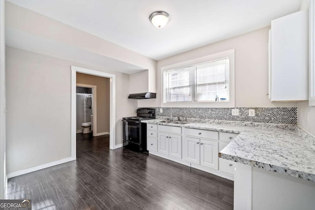 kitchen featuring a sink, backsplash, black range with electric stovetop, and white cabinetry
