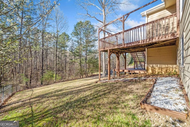 view of yard featuring stairway and a wooden deck