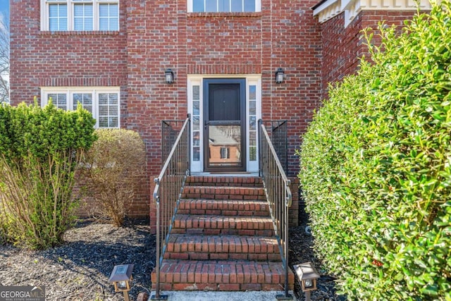 entrance to property with brick siding