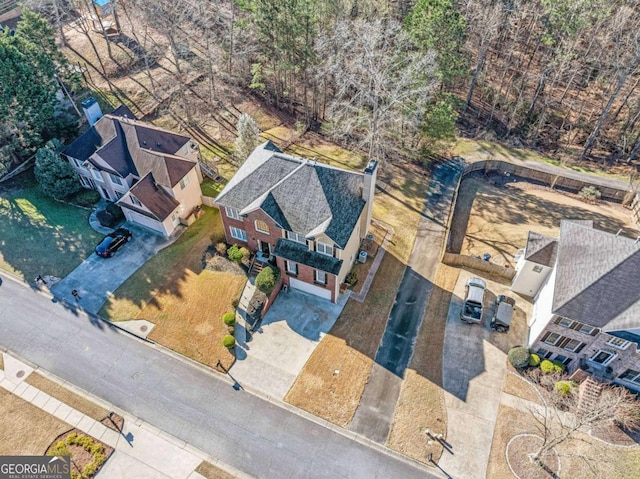 birds eye view of property with a residential view