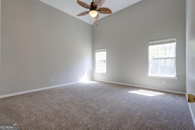 6251 Lamp Post Pl, Atlanta, GA 30349 - spare room with carpet, a ceiling fan, and high vaulted ceiling