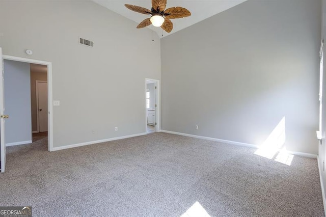 6251 Lamp Post Pl, Atlanta, GA 30349 - empty room featuring high vaulted ceiling, a ceiling fan, and carpet floors