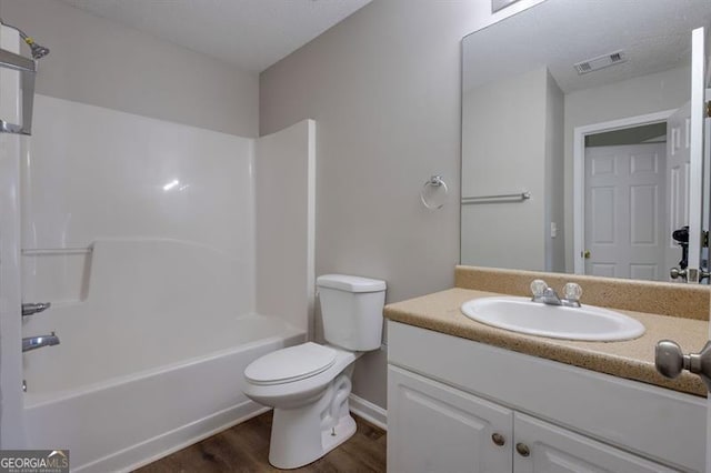 6251 Lamp Post Pl, Atlanta, GA 30349 - full bath with wood finished floors, vanity, and shower / bath combination