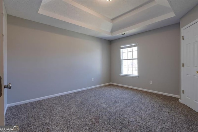 6251 Lamp Post Pl, Atlanta, GA 30349 - carpeted empty room featuring a tray ceiling and baseboards