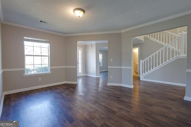 6251 Lamp Post Pl, Atlanta, GA 30349 - spare room with dark wood finished floors, a textured ceiling, stairway, and crown molding