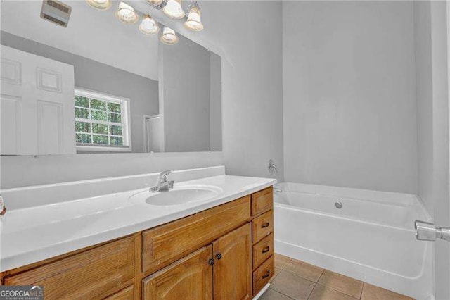 full bath with tile patterned floors, a shower, a tub to relax in, and vanity