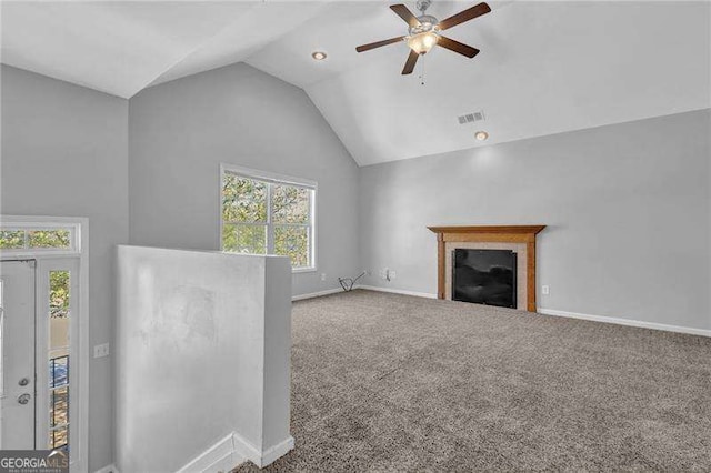 unfurnished living room with visible vents, baseboards, lofted ceiling, carpet floors, and a ceiling fan