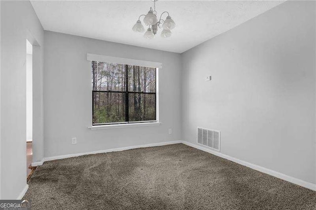 2895 Wildflower Ln, Snellville, GA 30039 - unfurnished room with a chandelier and carpet flooring
