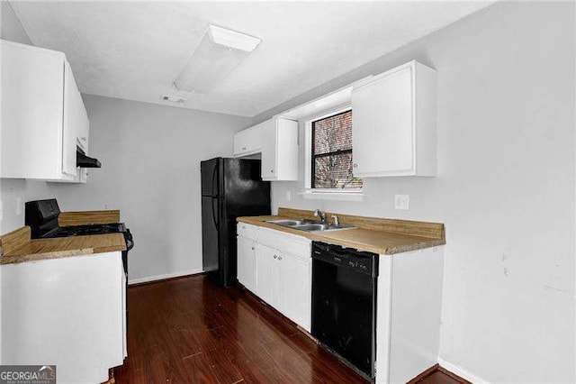 2895 Wildflower Ln, Snellville, GA 30039 - kitchen featuring black appliances, dark wood-style flooring, under cabinet range hood, and white cabinetry