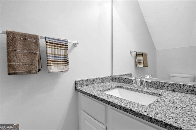 2895 Wildflower Ln, Snellville, GA 30039 - half bath featuring vanity and vaulted ceiling
