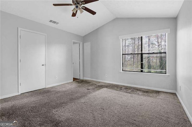 2895 Wildflower Ln, Snellville, GA 30039 - unfurnished bedroom featuring carpet, vaulted ceiling, and ceiling fan