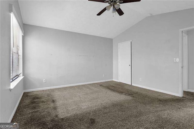 2895 Wildflower Ln, Snellville, GA 30039 - empty room with ceiling fan, carpet flooring, and vaulted ceiling