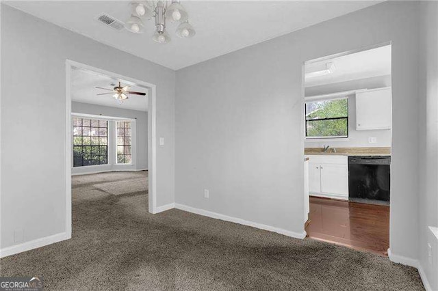 2895 Wildflower Ln, Snellville, GA 30039 - carpeted spare room with a chandelier, healthy amount of natural light, and a ceiling fan