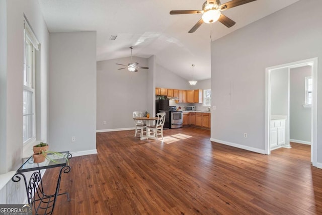 32 Martin Luther King Jr Dr, Commerce, GA 30529 - living room with baseboards, ceiling fan, vaulted ceiling, and dark wood-style floors