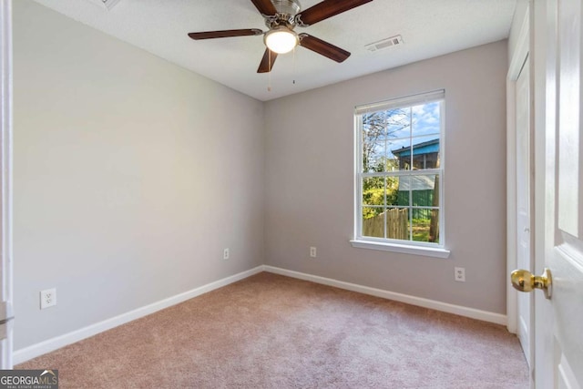 32 Martin Luther King Jr Dr, Commerce, GA 30529 - spare room featuring carpet floors, baseboards, a ceiling fan, and visible vents