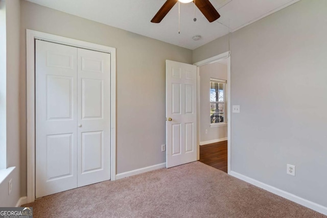 32 Martin Luther King Jr Dr, Commerce, GA 30529 - unfurnished bedroom featuring a closet, a ceiling fan, carpet, and baseboards