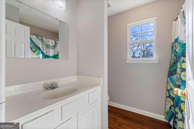 32 Martin Luther King Jr Dr, Commerce, GA 30529 - full bathroom featuring toilet, baseboards, wood finished floors, and vanity