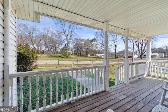 32 Martin Luther King Jr Dr, Commerce, GA 30529 - wooden terrace featuring covered porch
