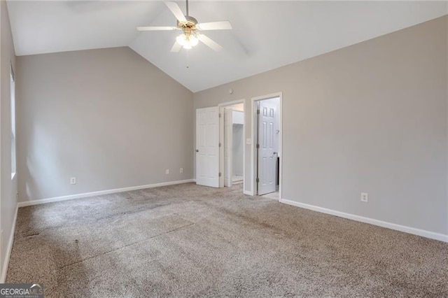 5027 Lower Elm St, Atlanta, GA 30349 - unfurnished bedroom with vaulted ceiling, light colored carpet, a ceiling fan, and a walk in closet