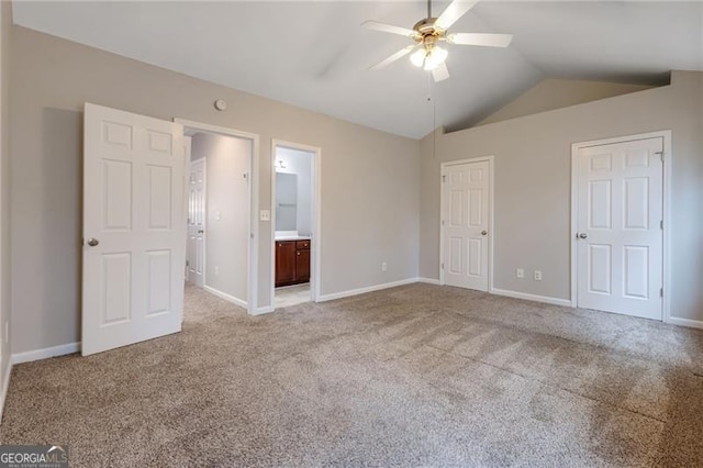 5027 Lower Elm St, Atlanta, GA 30349 - unfurnished bedroom with lofted ceiling, light carpet, connected bathroom, and a ceiling fan