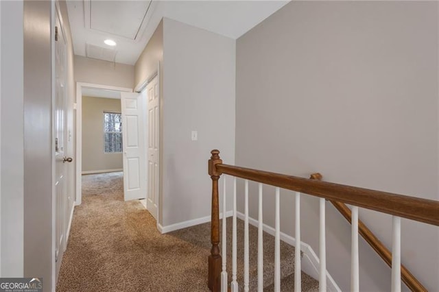 5027 Lower Elm St, Atlanta, GA 30349 - hall featuring attic access, carpet, and an upstairs landing