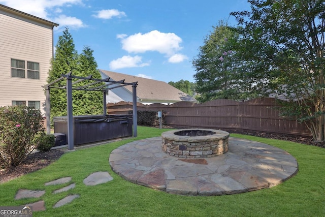 view of yard featuring a hot tub, fence, a fire pit, a pergola, and a patio area