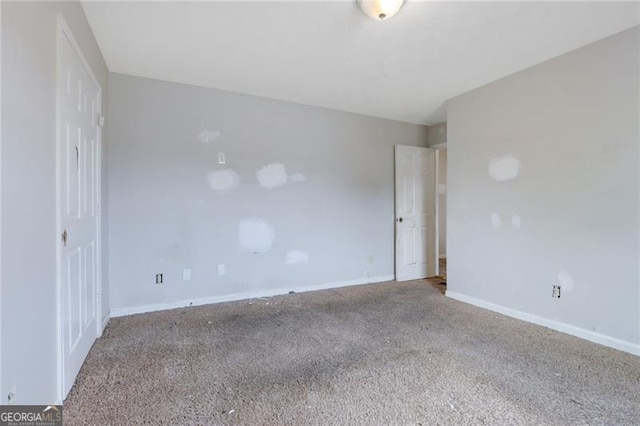 864 Oakhill Ct, Stone Mountain, GA 30088 - carpeted spare room featuring baseboards