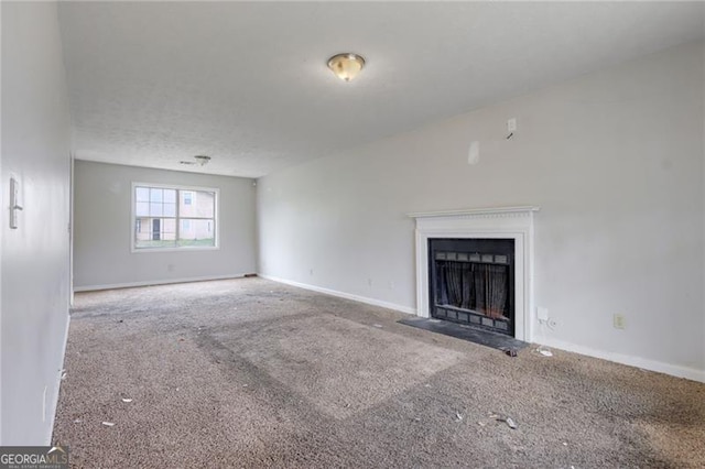 864 Oakhill Ct, Stone Mountain, GA 30088 - unfurnished living room featuring carpet floors and a fireplace with flush hearth