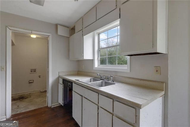 864 Oakhill Ct, Stone Mountain, GA 30088 - kitchen with dark wood-type flooring, white cabinets, light countertops, and black dishwasher