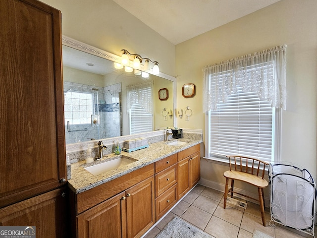 403 Holiday Rd, Franklin, GA 30217 - bathroom featuring tile patterned flooring, double vanity, tiled shower, and a sink