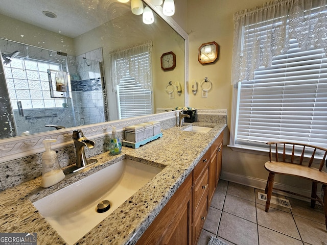 403 Holiday Rd, Franklin, GA 30217 - bathroom featuring a sink, baseboards, tiled shower, and tile patterned flooring