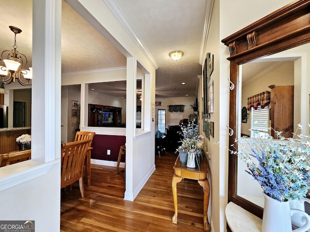 403 Holiday Rd, Franklin, GA 30217 - corridor with a chandelier, ornamental molding, baseboards, and wood finished floors