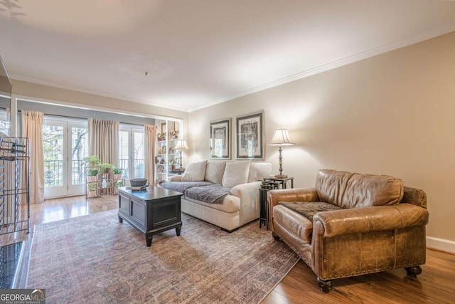 dining area featuring crown molding, light wood-type flooring, and visible vents