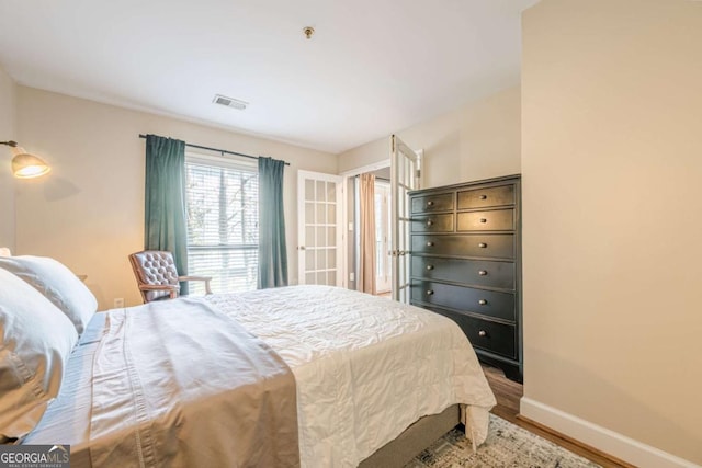 3201 Lenox Rd NE Unit 16, Atlanta, GA 30324 - bedroom featuring baseboards and wood finished floors