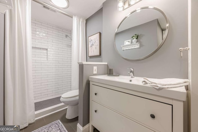 bedroom with visible vents, baseboards, and light wood finished floors