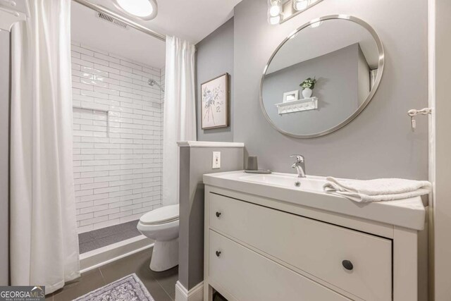 3201 Lenox Rd NE Unit 16, Atlanta, GA 30324 - full bathroom with vanity, tile patterned floors, and a tile shower